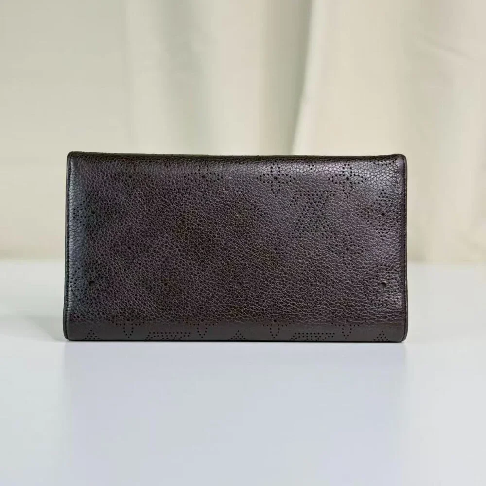 Louis Vuitton Black Monogram Canvas Wallet with Gold Hinge Detail Elegant Design